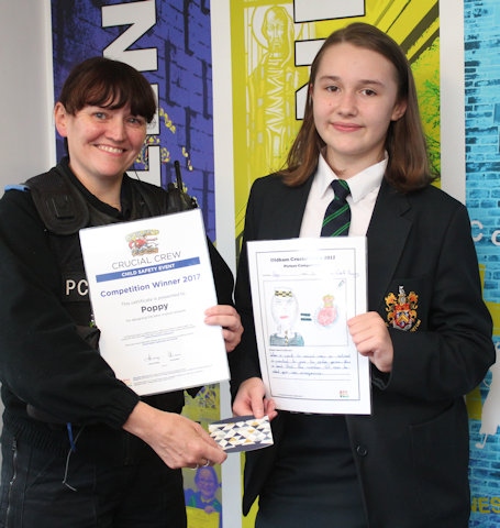 Suzanne Hudson of Greater Manchester Police presenting Poppy Booth with her prize