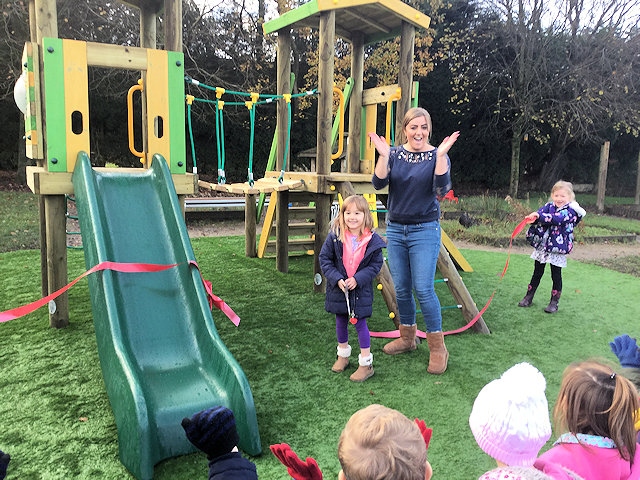Billie Taylor cutting the ribbon, with Miss Jenkinson, reception teacher Billie Taylor cutting the ribbon, with Miss Jenkinson, reception teacher