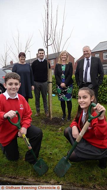 TREE planting . . . Jack Ogden (10) and Aaliya Qaziy (10) with, from left, deputy head Lizzie Egan-Walsh, deputy head Rob Hollinsworth, Helen Rowland, chief executive of Focus Trust and head teacher Nigel Fowler