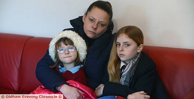 SHIVERING . . . Sharon Rhodes with her daughters Crystal and Chantelle