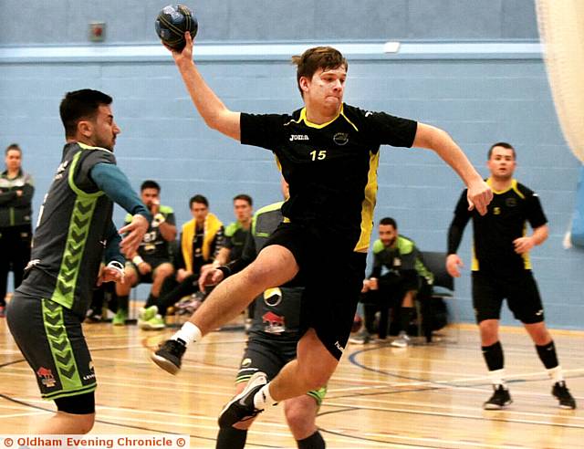 UP AND AT 'EM...Ed Page, of North East Manchester Hawks, goes for goal.