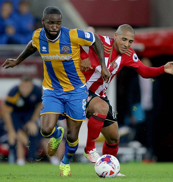 SHREWS' DANGER MAN . . . Abu Ogogo (left) battles hard in the centre of midfield