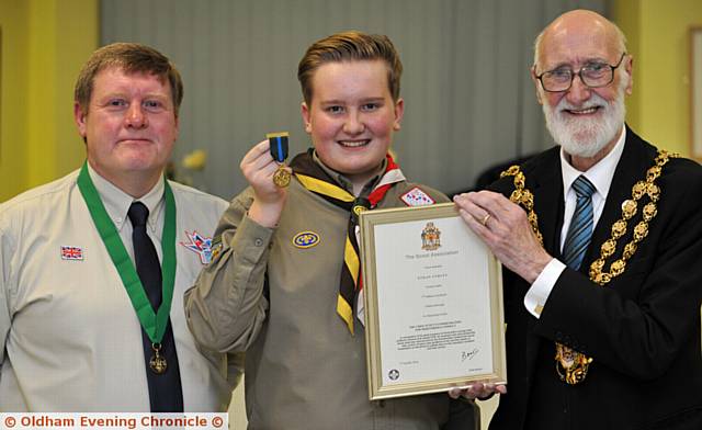 DIB, dib, dib ­- good job, good job, good job . . . super scout Ethan Curley with David Hamilton (District Commissioner) and Oldham Mayor, Councillor Derek Heffernan
