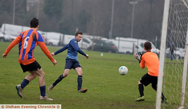 IT'S THERE: Sam Robinson scores Royton's first goal