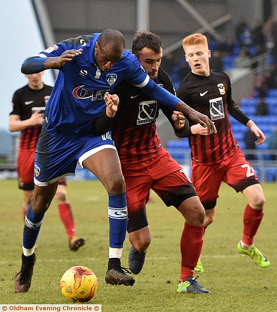 UP FOR THE BATTLE...Michael Ngoo grapples with a Coventry City rival