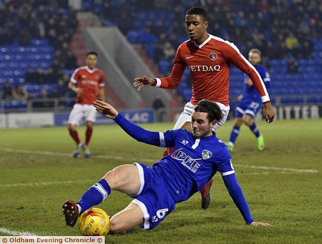 MY BALL . . . Aiden O'Neill slides in to gain possession