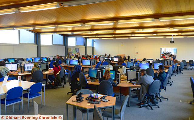 PLANS to merge Oldham (the college's computer room is pictured here) with colleges in Tameside and Stockport have been scrapped