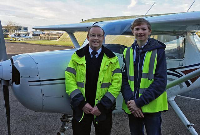 HIGH flyer . . . Harry Tait and flight instructor John Cheetham