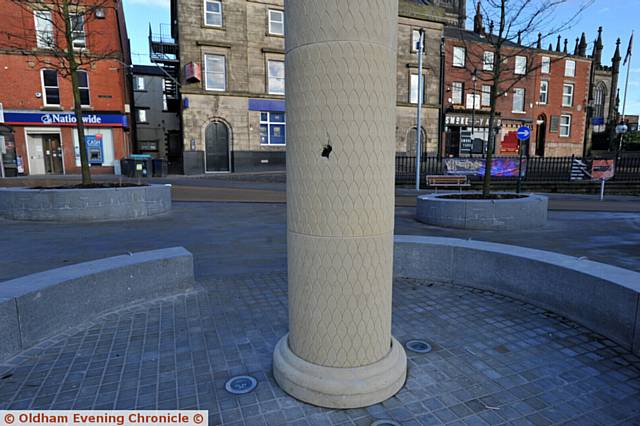 HOLE . . . A hole appeared in the owl column in Parliament Square caused by construction work in the area