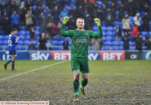 MUDDY MARVEL . . . spot-kick saviour Connor Ripley salutes the supporters at the final whistle
