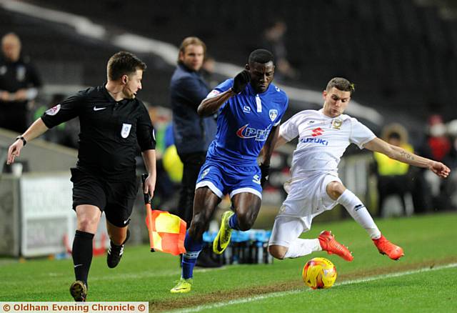 TOUCH AND GO...new signing Tope Obadeyi attempts to skip beyond an MK Dons challenge. PICTURES by ALAN HOWARTH