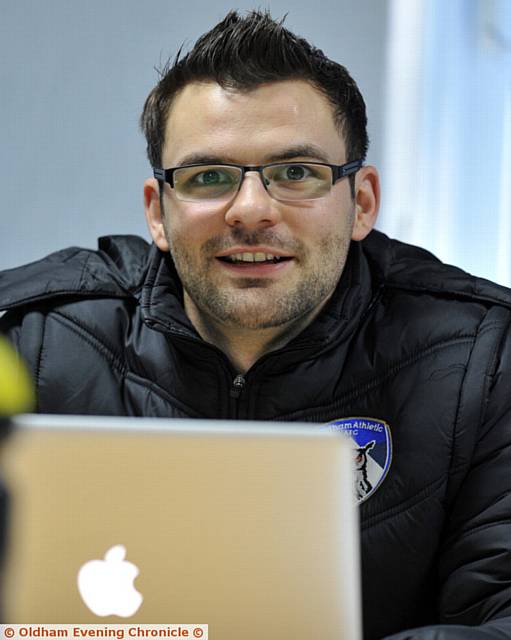 OFFICE WORK . . . analyst Conor with his laptop in the office
