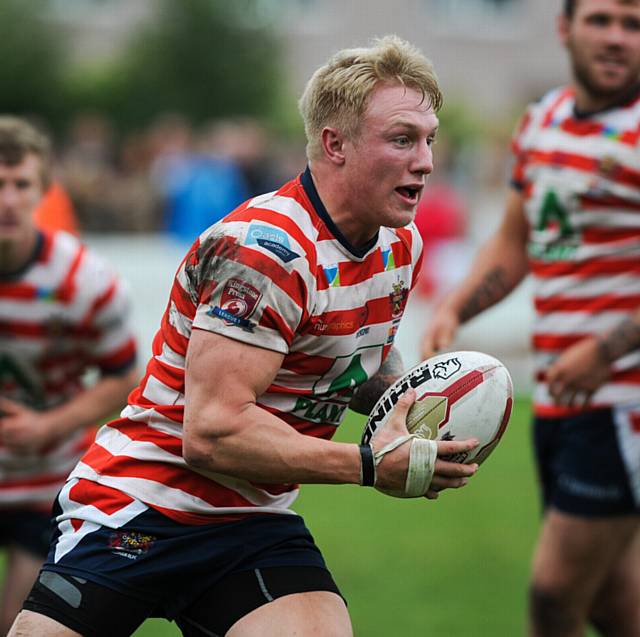 KEEPING COOL . . . That's the challenge for fiery Oldham player George Tyson