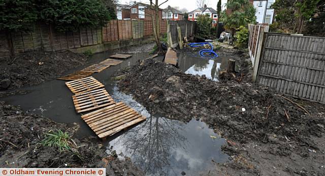 MUDDY hell . . . the alley way which connects Cartmel Crescent to Northfield Road in Chadderton