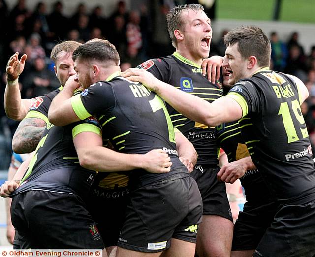 Oldham Rougheds V Rochdale Hornets, match played at the Spotland ground, Rochdale. Oldham player,(green strip), Oldham team members celebrate, Michael Ward's, all important try during the second half of the game..
