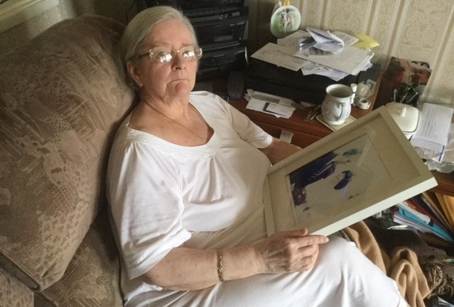 SADNESS . . . Maureen Toogood with a photo of her husband    