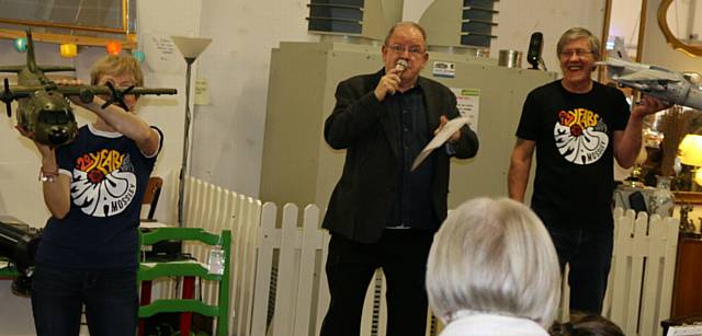 CELEBRATIONS . . . Actor and patron of Emmaus Mossley John Henshaw (centre) leads the auction at the 20:20 event