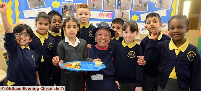 HAPPY BIRTHDAY . . . Florence Lowe, Broadfield Primary School dinner lady celebrates her 80th birthday with some of her happy customers