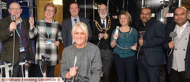 GUIDED tour, from left, councillors Eddie Moores and Susan Dearden, owner Phil Delaney, Mayor Councillor Derek Heffernan, Clare Taylor (Action Oldham), Muz Khan, Abidul Islam. In foreground is Amanda Delaney.
