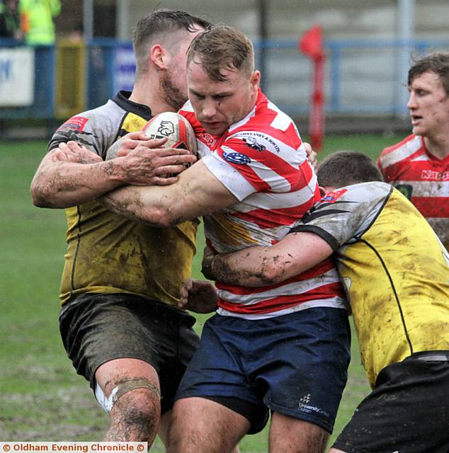 HELD UP . . . Oldham forward Danny Langtree