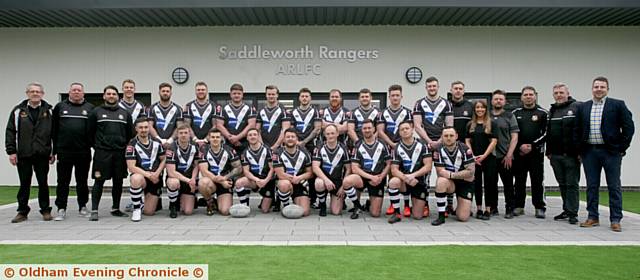 ON PARADE . . . Saddleworth Rangers players, officials and coaching staff in front of the new clubhouse at Shaw Hall Bank Road