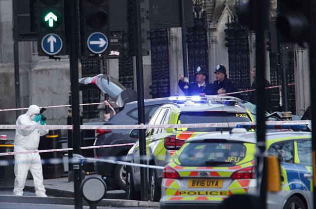 FORENSIC officers close to the Palace of Westminster