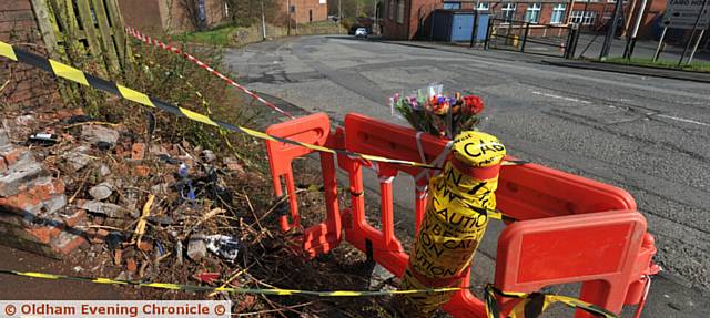 FLORAL tributes left at the scene on Greenacres Road.