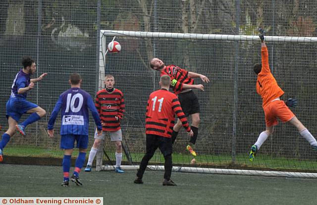 GET IN THERE . . . Crown's Nathan Barker (left) heads home