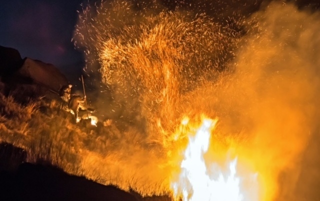 FARMERS tackle the moorland fire. Picture by CRAIG HANNAH