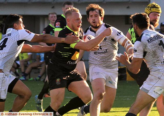 OLDHAM'S Scott Leatherbarrow attacks the Toulouse line