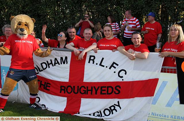 HERE we go . . . Oldham fans and Roary the mascot cheer on the team at the match in Toulouse