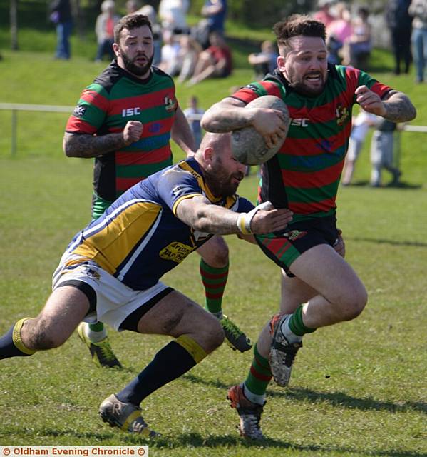 KNEES UP . . . Waterhead's Dale Lowe tries make a break. 
