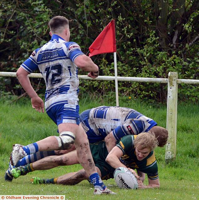 IN AT THE CORNER . . . Kieran McGinnity dives over for Oldham St Anne's. PICTURES by ANTHONY MILLER