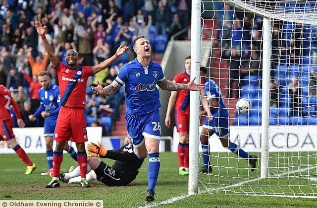 GOAL! That man Peter Clarke turns away after scoring Athletic's equaliser against Rochdale. 