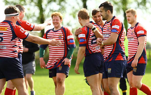 CELEBRATION TIME . . . (right group) Jack Taylor, Josh Watson, Jordan McEwan and Charlie Roscoe enjoy a try