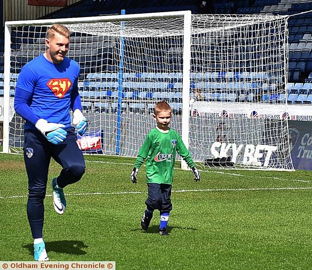 Goalkeeper Connor Ripley with Thomas Young at Oldham Athletic v Rochdale match. Thomas wrote to the club when he found out Connor was to leave Athletic at the end of the season.