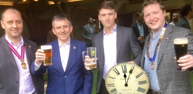 CLOCKING in . . . Tim Coulter, centre, with chairman Mike Coulter, right, Tim's father Michael and, left, Mike Procter, area vice chairman