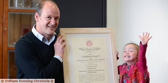 Bravery award from the Royal Humane Society presented to Graham Smith Scott by the Mayor Cllr. Derek Heffernan, for his actions helping out when a car crashed onto on a 100 foot cliff ledge in Whitby. Pic with one of his daughters, Halle Smith Scott.