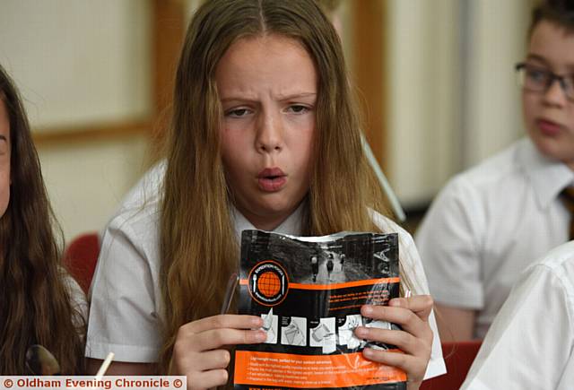 Children at St Joseph's RC primary school in Shaw testing expedition food with teacher Steve Hill. Mr Hill is off to the jungle to take part in a charity endurance run. PIC shows Olivia Holden.
