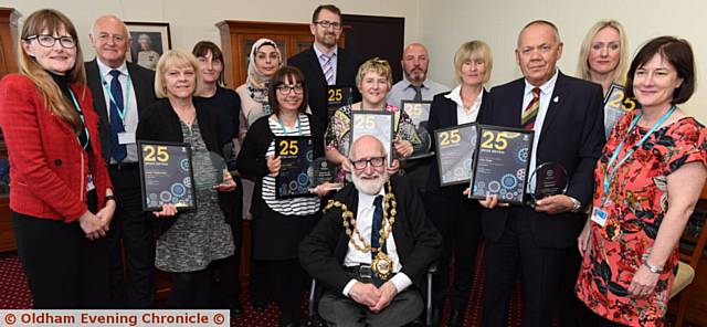 LONG service awards presented by Oldham Council chief executive Carolyn Wilkins, Ray Ward (executive director for corporate and commercial) and (right) Helen Lockwood (executive director for skills and economy)