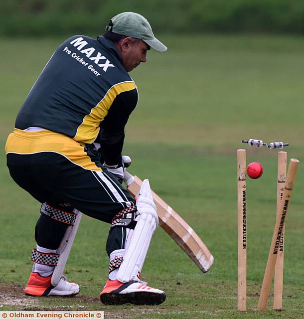 CLEANED UP: Oldham captain Rashid Hussain is bowled. 