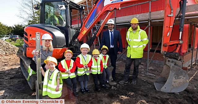 Children at Yew Tree Community School in Chadderton on site of their new nursery building. PIC L-R: Martine Buckley (Executive Head), Teddy Buckley, Samuel Hopkinson, Layla Hague, Henzi Lees, Zahra Hussain, Rais Bhatti (Head of School) and Richard Eccles (RH Fullwood and Co Ltd).