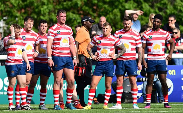 FAMILIAR POSE . . . Oldham's players react after another Broncos try