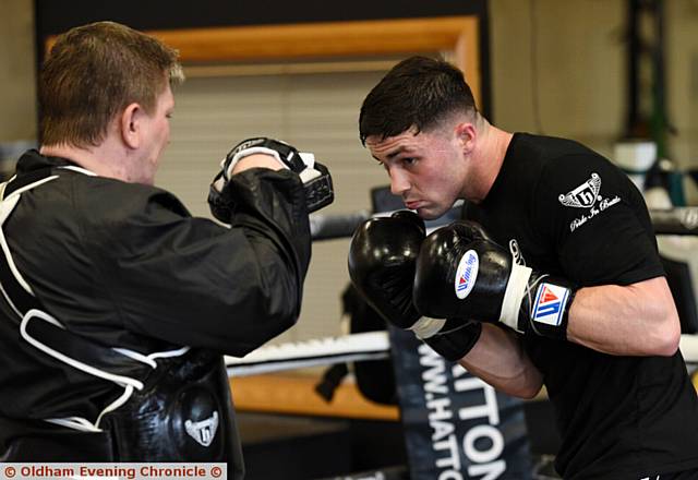 HARD GRAFT . . . Ricky Hatton puts Mark Heffron through his paces