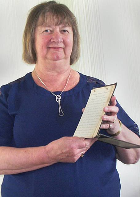 Joan Cheetham with her grandfather's diary. John Wolstencroft, from Oldham, lived in Russia until the revolution in 1917.