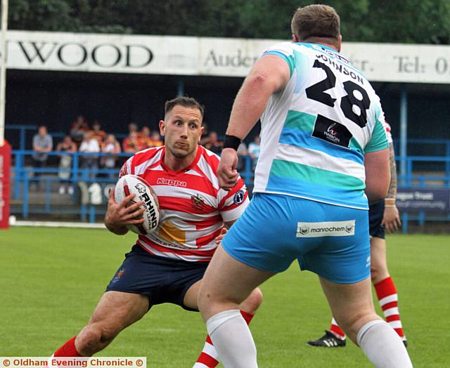 STEPPING INSIDE: Oldham forward Adam Neal tries to out-fox the Rams defence at Bower Fold. PICTURE by DAVE MURGATROYD