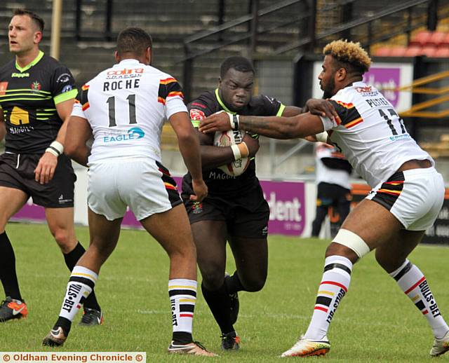 RUNNING HARD: New Oldham man Sadiq Adebiyi tries to break through at Bradford. PICTURES by DAVE MURGATROYD