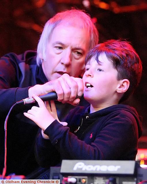 ON the mic . . . DJ Clint Boon, entertains the crowd at the picnic in the park, along with , Hunter Morgan (6) who's family were best friends with Lisa Lees