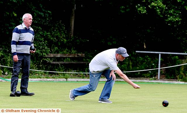 WINNER of the Hollinwood qualifier, Darren Griffiths (right), releases a delivery, with Peter Kostyk looking on