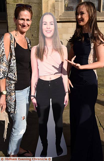 SURPRISE . . . Louise Bingham seeing her older sister’s Chloe’s ful-size cutout her mum Karen (left) had produced